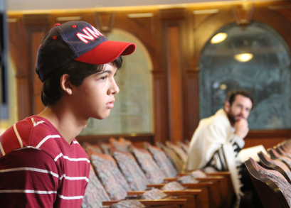 Josh (Luca Oriel) and Rabbi Brookstein (Sean McConaghy) at the synagogue.
