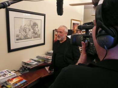 Drew Struzan observing his artwork at Lucasfilm Studios on the set of DREW: THE MAN BEHIND THE POSTER.