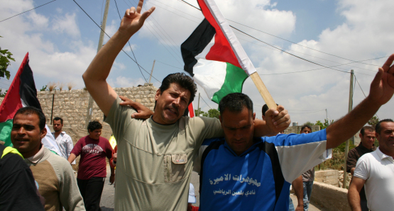 Adeeb & Phil participate in a protest against the Israeli settlements. 