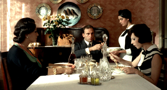 Jean-Louis Trintignant's Marcello Clerici dines at the family home of his fiancee Giulia (Stefania Sandrelli) in Bernardo Bertolucci's THE CONFORMIST. The cinematography is by Vittorio Storaro.