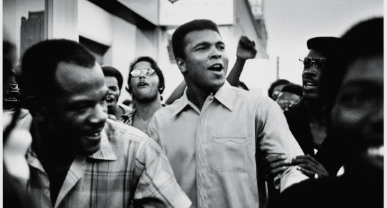 Muhammad Ali walks through the streets of New York City with members of the Black Panther Party in September 1970.
