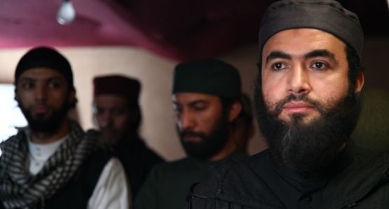 Mohammed Taleb as the avuncular terrorist leader Abou Zoubeir (right)