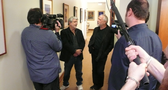 George Lucas and Drew Struzan discuss art at Lucasfilm during the filming of DREW: THE MAN BEHIND THE POSTER.