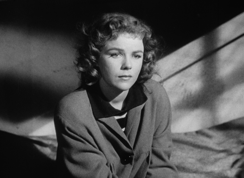An imprisoned Sally (Sally Forrest) remembers what brought her to this moment in Ida Lupino's NOT WANTED.